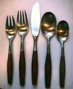 Flatware sparkling in the light.